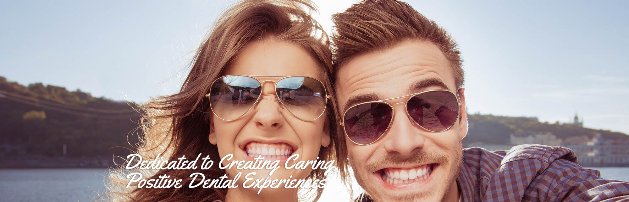 Young happy couple smilling to show off their bright white smiles